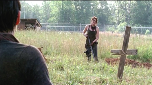 Maggie looks longingly at Glenn as they dig graves for those lost to the flu.